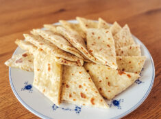 Norwegian lefse with kling (butter and sugar filling) arranged on a plate